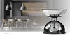 A kitchen scale in the foreground with a blurred kitchen interior in the background. Náhľad obrázku produktu