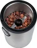 A close-up view of the inside of a coffee grinder filled with coffee beans. Voir les images du produit