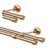 A close-up view of a double curtain rod with a bronze finish. Anteprima dell’immagine prodotto