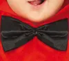Close-up of a baby wearing a red costume with a black bow tie. Voir les images du produit