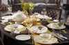 A formal dining table setting with Villeroy & Boch Ivoire dinnerware, wine glasses, and a centerpiece. Produktbild-Vorschau