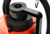 Close-up of the top part of an orange and black vacuum cleaner, showing the handle, switch, and hose connection. Náhled obrázku produktu