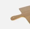 A close-up shot of a wooden cutting board with a handle, isolated on a white background. Podgląd zdjęcia produktu