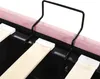 A close-up view of a bed frame with wooden slats and a black metal support. Produktbild-Vorschau