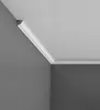 A corner of a room showing crown molding installed along the ceiling and wall. Produktbild-Vorschau
