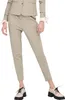 A person wearing a beige suit and pants with black shoes. Produktbild-Vorschau