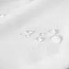 Close-up of water droplets on a white fabric surface. Náhled obrázku produktu