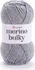 A ball of grey yarn with a label. Produktbild-Vorschau