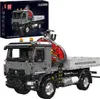 A toy construction truck with a crane, shown from a diagonal angle, with its packaging box in the background. Produktbild-Vorschau