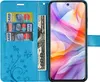 A blue flip-style phone case with card slots and a bill compartment, open to reveal a smartphone with a colorful wallpaper. Produktbild-Vorschau