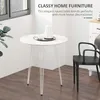 A white round table with decorative items on it, in a room with a window and a black chair. The text "CLASSY HOME FURNITURE" and "This elegant round table blends perfectly with most home decoraciones" is overlaid on the image. Produktbild-Vorschau