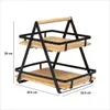 A two-tiered storage rack with a handle, made of black metal and wood. Podgląd zdjęcia produktu