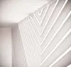 An abstract architectural interior with a focus on a decorative wall feature. Náhľad obrázku produktu