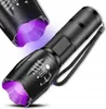 Two black flashlights with purple light emitting from the front, one slightly behind the other. Produktbild-Vorschau