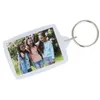 A keychain with a photo of three young girls. Produktbild-Vorschau