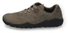 A side view of a single khaki and black Dockers sneaker against a white background. Produktbild-Vorschau