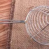A close-up of a stainless steel skimmer with a wire mesh basket, resting on a burlap fabric and a wooden surface. Produktbild-Vorschau