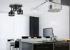 A modern kitchen and dining area with a ceiling light fixture. Produktbild-Vorschau