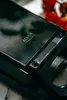 A close-up shot of a black appliance with the brand logo visible. Náhľad obrázku produktu
