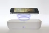 A smartphone is levitating above a white UV sanitizing box. Produktbild-Vorschau