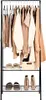 A freestanding garment rack with two shelves, displaying various clothing items and shoes. Produktbild-Vorschau