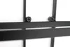 A close-up view of a black metal wine rack, showing two screws attaching a horizontal bar to a vertical bar. Náhled obrázku produktu