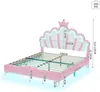 A pink princess bed with a crown-shaped headboard and LED lighting, shown with dimensions indicated by measurement lines and text. Podgląd zdjęcia produktu