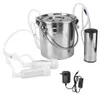 A stainless steel milking machine with its accessories and power adapter, laid out on a white background. Produktbild-Vorschau