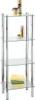A four-tiered glass shelf unit with chrome legs, holding toiletries and towels. Produktbild-Vorschau
