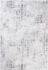 A close-up, top-down view of a rug with a distressed, abstract pattern. Anteprima dell’immagine prodotto