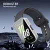 A smartwatch with a protective case is shown in a dramatic, rocky environment with debris flying. Produktbild-Vorschau