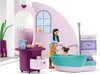 A toy playset depicting a pet grooming salon with a girl washing a pug in a bathtub. Produktbild-Vorschau