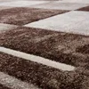 A close-up view of a textured rug with a geometric pattern. Produktbild-Vorschau