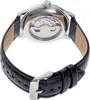 The back of a watch with a leather strap and a visible mechanical movement. Produktbild-Vorschau
