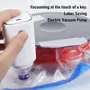 A hand is holding a white electric vacuum pump, using it to remove air from a clear plastic bag containing red filament, presumably for 3D printing. Náhľad obrázku produktu