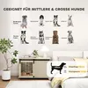 A dog crate is shown in a bedroom setting, with various dog breeds illustrated on the wall above it. Náhled obrázku produktu