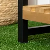 Close-up of a plant stand on artificial grass, with a woven basket in the background. Produktbild-Vorschau