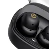 Close-up view of black wireless earbuds inside their charging case. Náhled obrázku produktu