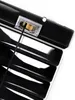 A close-up view of the top mechanism of black blinds, showing the cord and pulley system. Produktbild-Vorschau