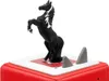 A black toy horse figurine is standing on a white and red platform, with two gray shark fins protruding from the platform. The platform is on top of a red textured object. Produktbild-Vorschau