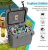 A cooler filled with drinks and ice, placed on grass next to a picnic blanket and a bottle of wine, with a lake and trees in the background. Náhľad obrázku produktu
