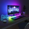 A gaming setup with a monitor, keyboard, mouse, and a 3D game controller lamp. Náhled obrázku produktu