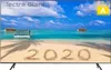 A television screen displaying a tropical beach scene with the year 2020 written in the sand. Produktbild-Vorschau