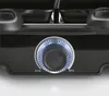 Close-up of a black raclette grill with a lit control knob. Voir les images du produit