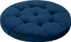 A round, tufted cushion in a deep blue color.