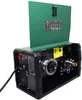 A welding machine with its lid open, showing internal components and a spool of wire. Produktbild-Vorschau
