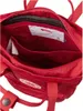 Close-up view of the interior of a red backpack. Produktbild-Vorschau