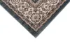 A close-up view of the corner of a rug with a traditional pattern. Voir les images du produit