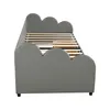 Side view of a grey upholstered daybed with a cloud-like design on its sides and back. The wooden slats of the bed frame are visible. Produktbild-Vorschau
