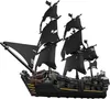 A black pirate ship model with black sails and gold accents, set against a white background. Podgląd zdjęcia produktu